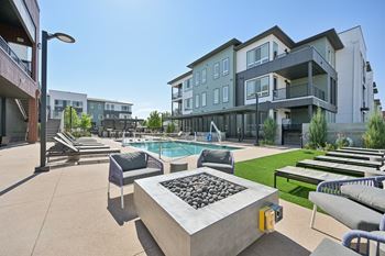 Outdoor courtyard with swimming pool and fire pit